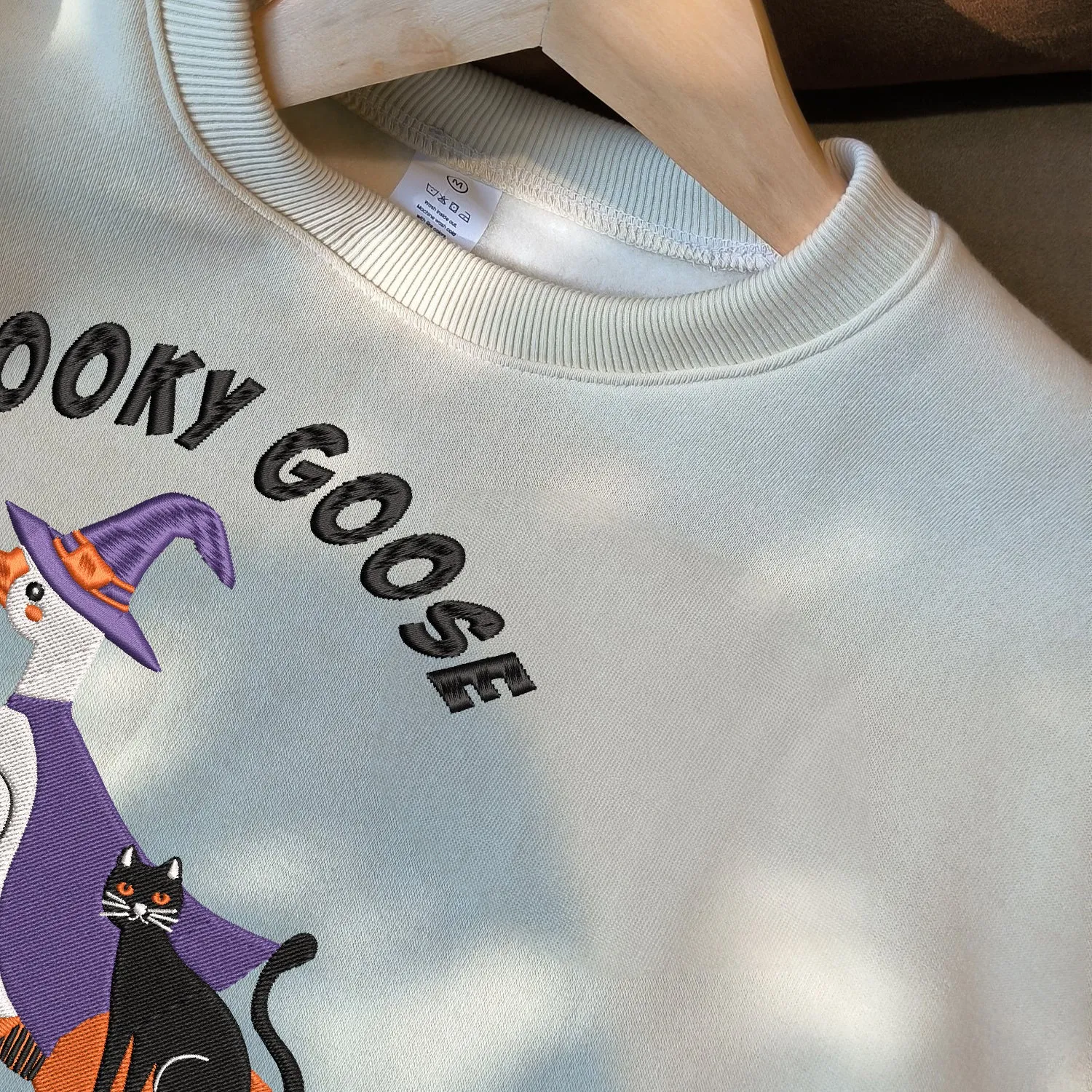 Teesdily | Halloween Witch Goose Embroidered Shirt, Spooky Goose On The Loose Sweatshirt Embroidery, Funny Goose And Black Cat Halloween Shirt Gift