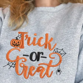 Teesdily | Pumpkin Trick Or Treat Embroidery Shirt, Halloween Pumpkin Embroidered Sweatshirt, Pumpkin Spiderweb Halloween Shirt, Holiday Outfit Gift